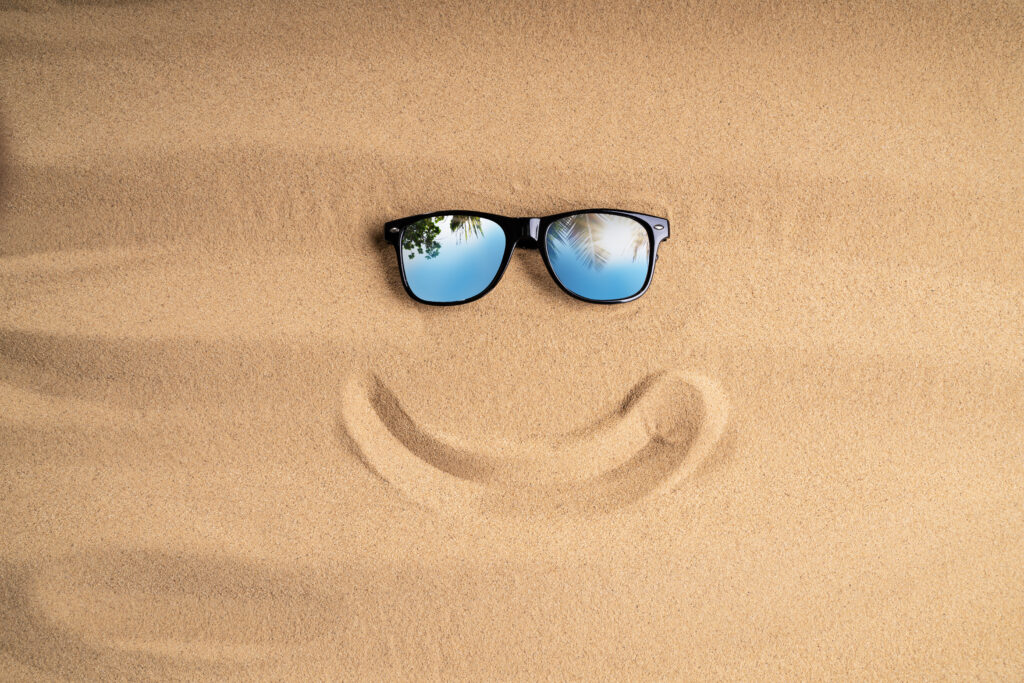Sunglasses On Sand At Beach
