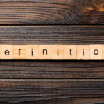 Definition word written on wood block. Definition text on wooden table for your desing, concept