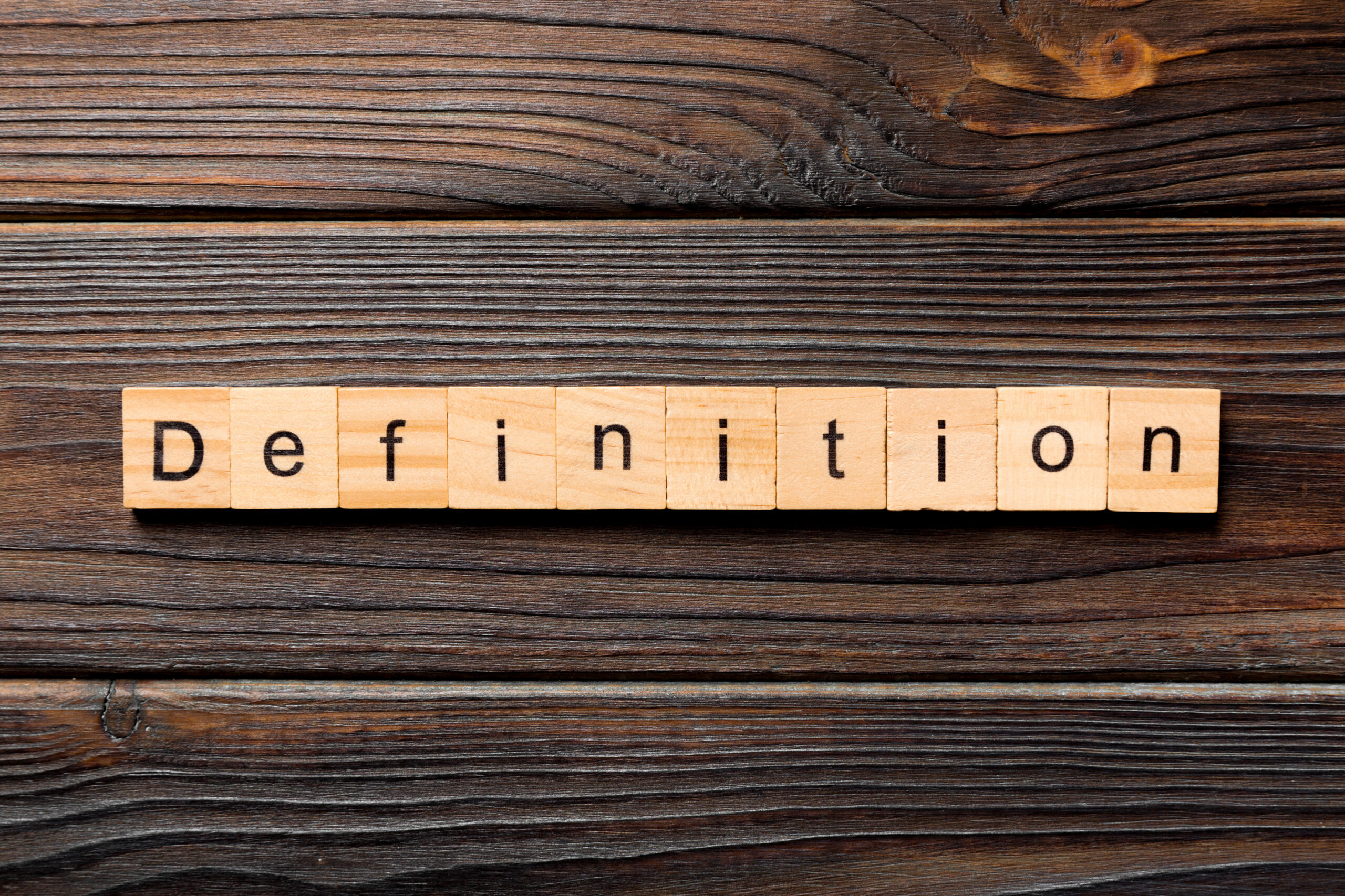 Definition word written on wood block. Definition text on wooden table for your desing, concept